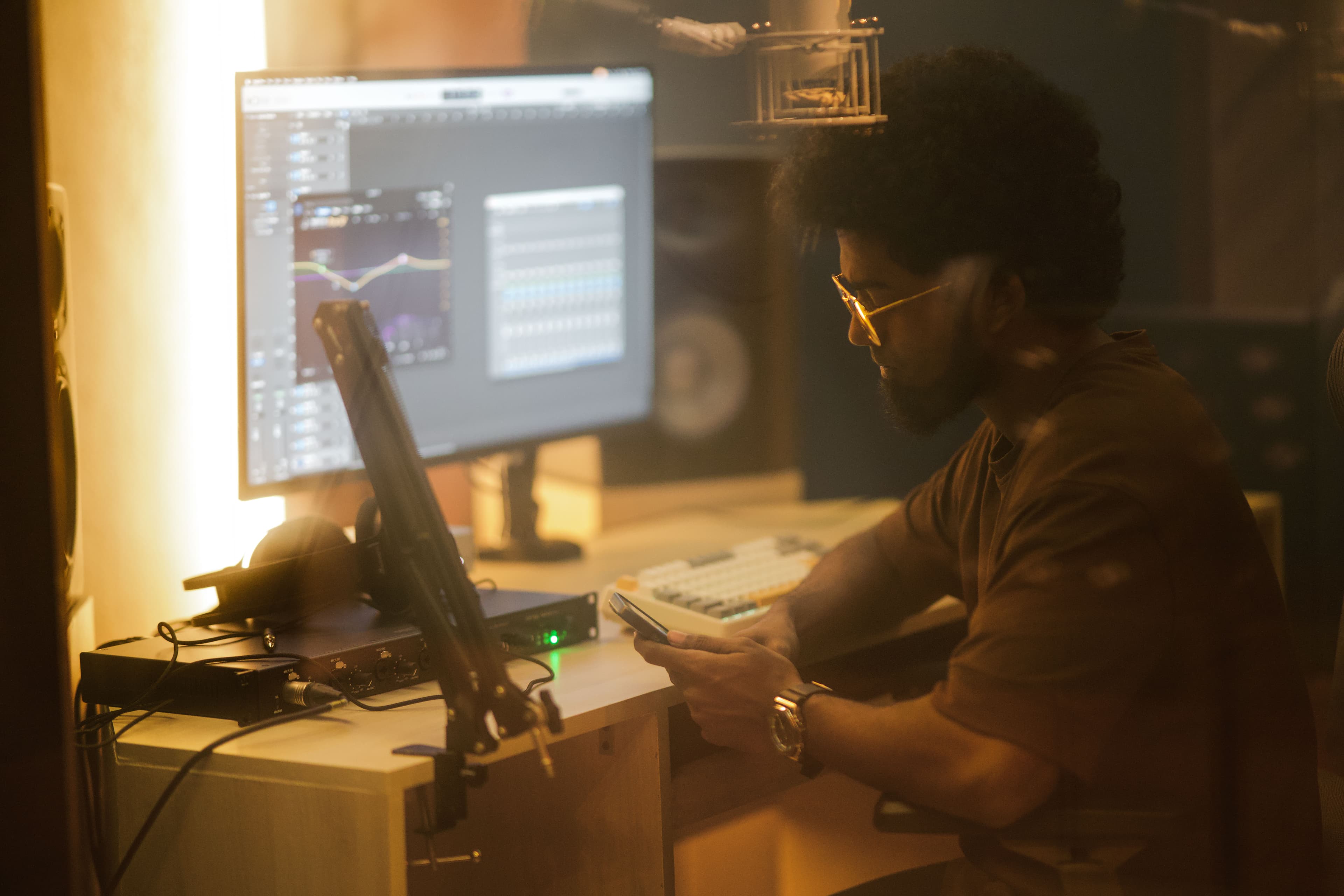 Producer working at the mixing desk at Abylon studio, Kerala
